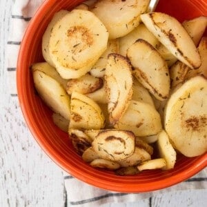 Parsnips in a on orange bowl.