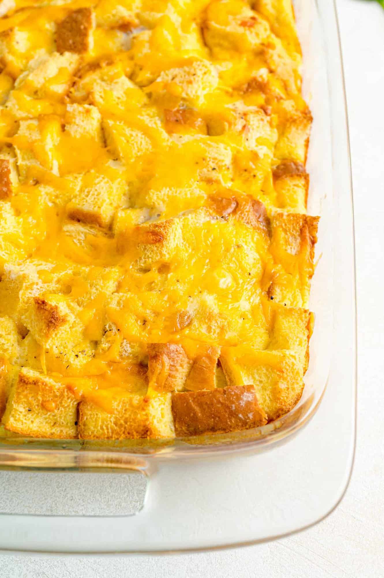 Breakfast casserole in a clear glass casserole dish.