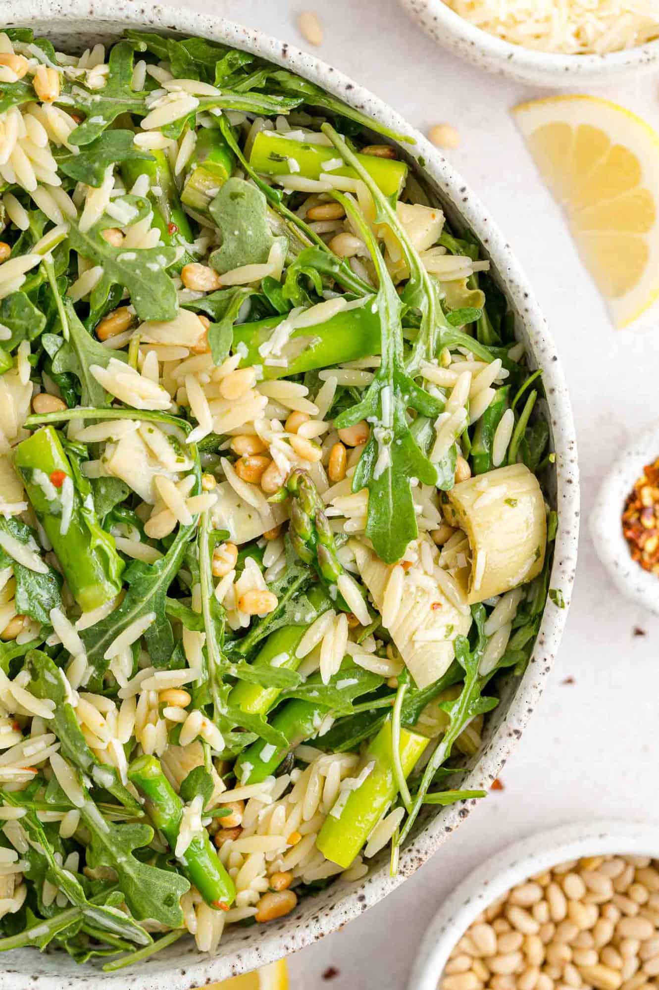 Orzo salad with arugula, asparagus, artichokes, pine nuts.