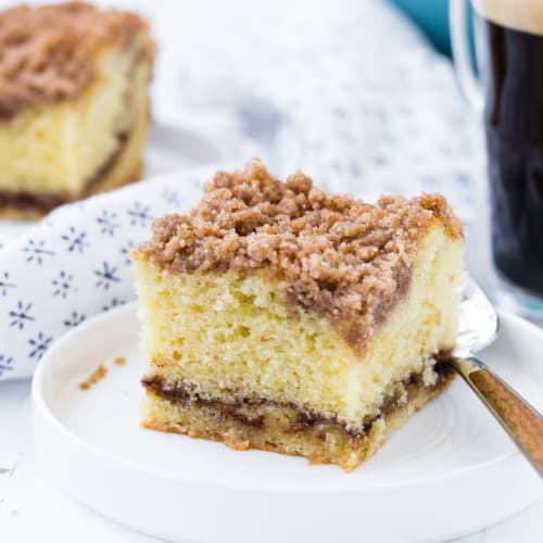 Slice of cinnamon coffee cake with streusel.