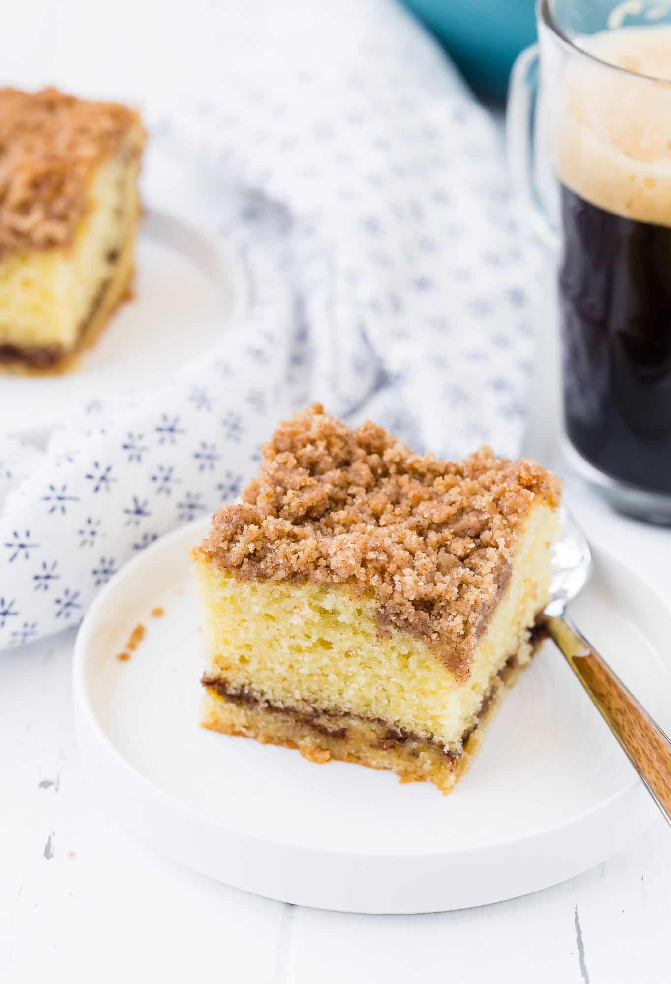 Slice of cinnamon coffee cake with streusel.