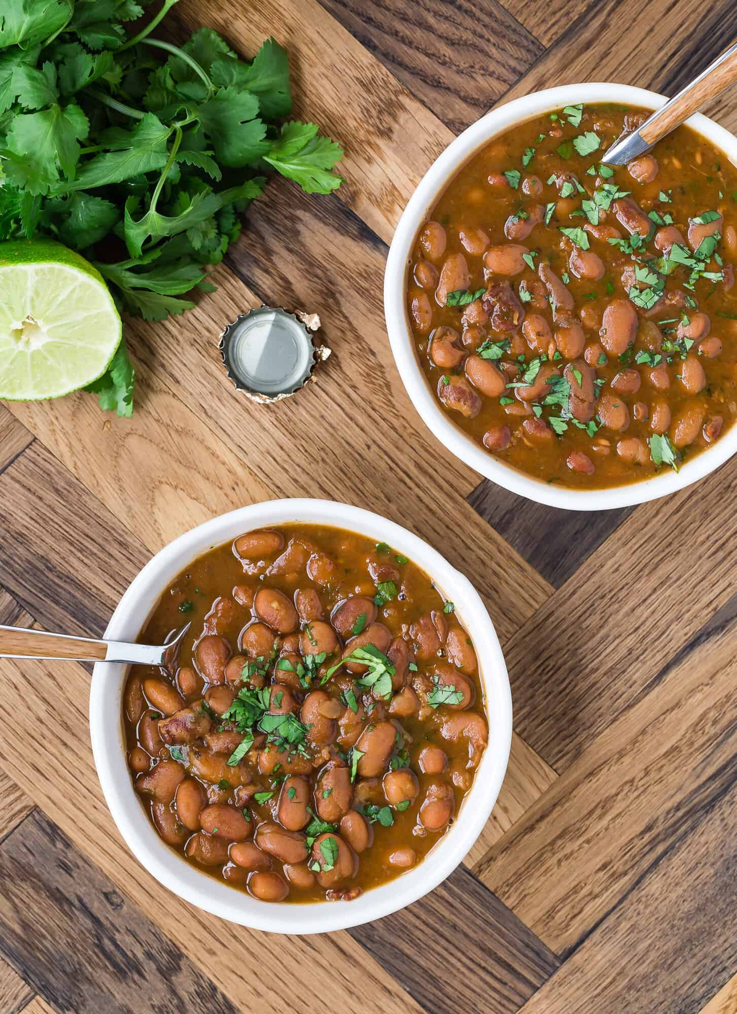 Drunken beans, beer cap, cilantro, half of a lime.