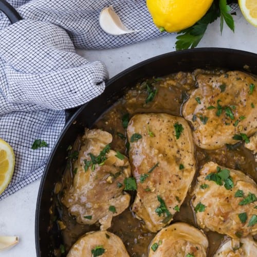 Pork with lemon garlic sauce and parsley.