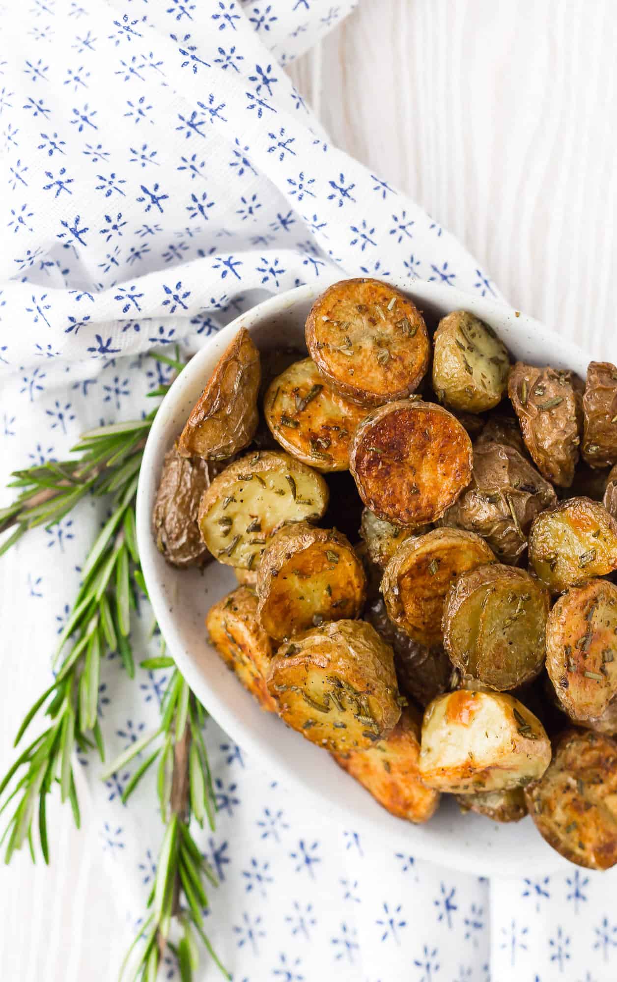 Overhead view of roasted potatoes in a small bowl.