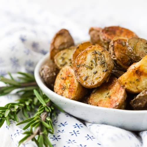 Rosemary roasted potatoes in a small bowl.