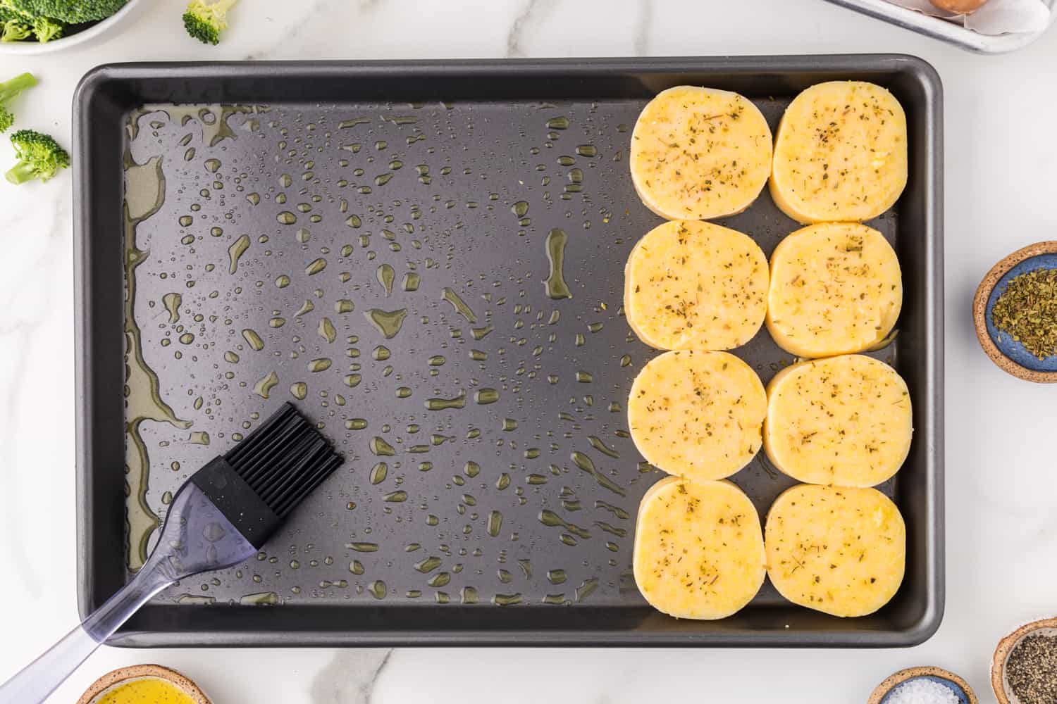 Sliced polenta on sheet pan.
