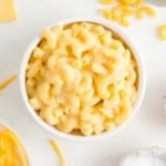 Creamy microwave mac and cheese in a white bowl.