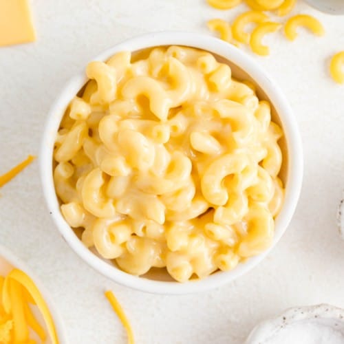 Creamy microwave mac and cheese in a white bowl.