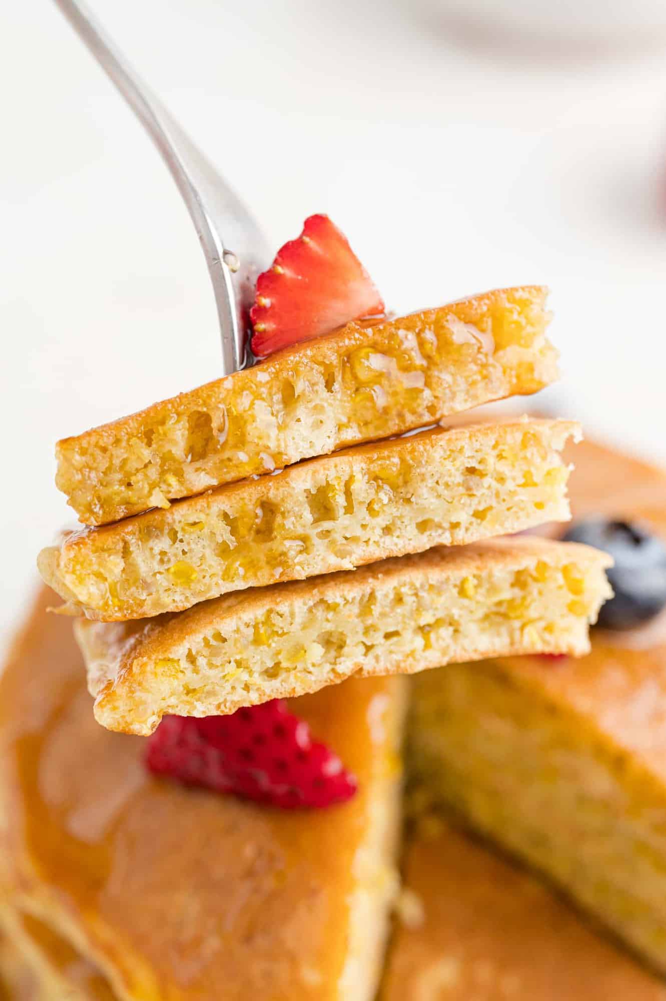 Pancakes on a fork, cut to show texture.