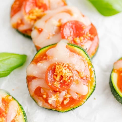 Zucchini pizza bites with basil.