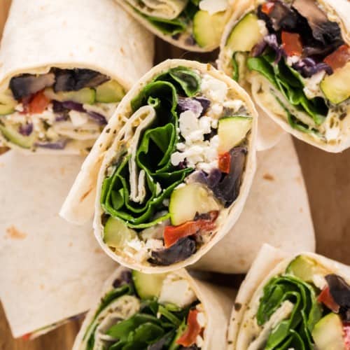 Multiple vegetable wraps, cut to show filling.