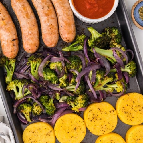 Sheet pan italian sausage, broccoli, and polenta, with a side of tomato sauce.