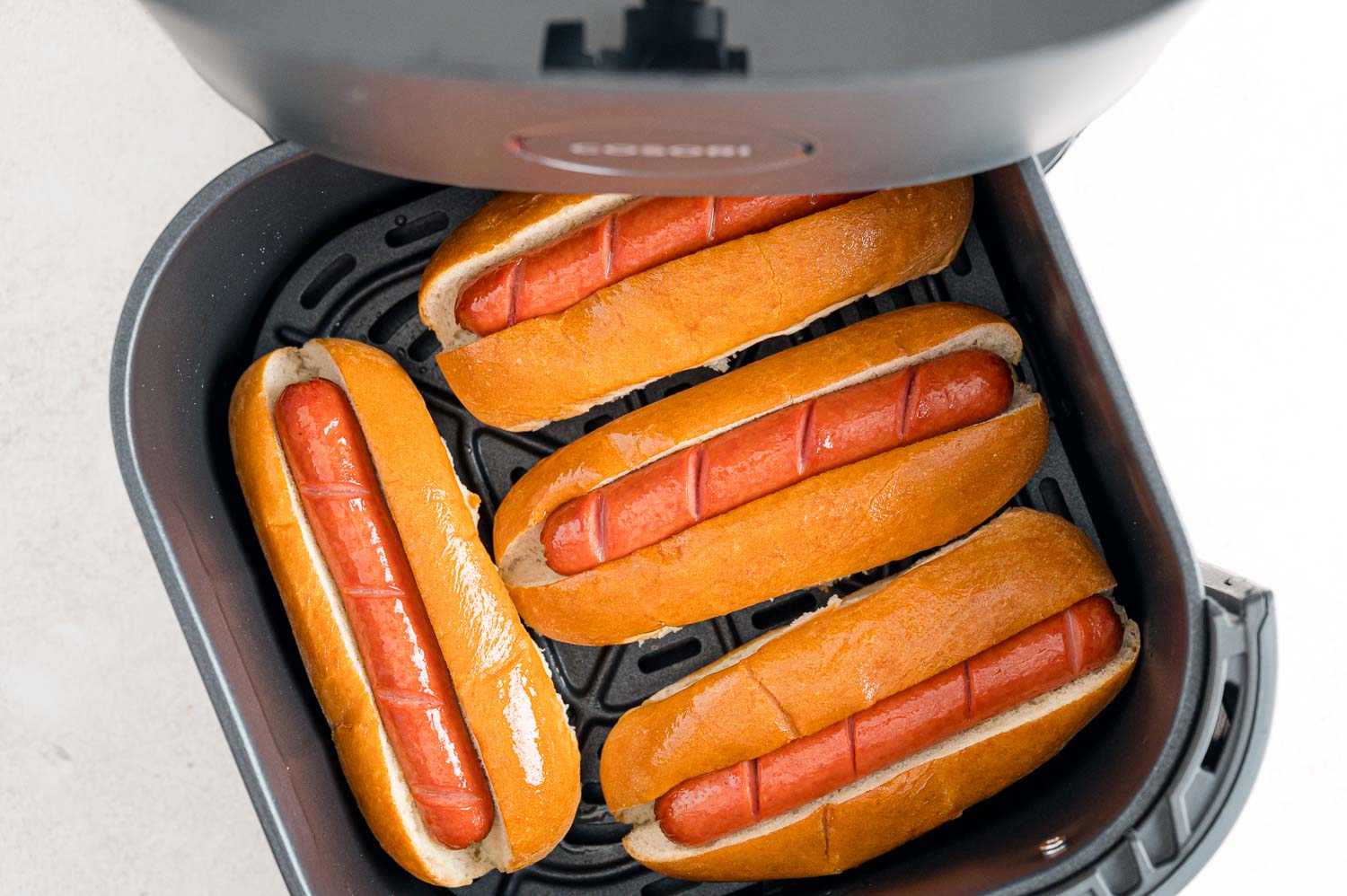 Hot dogs and buns in air fryer.