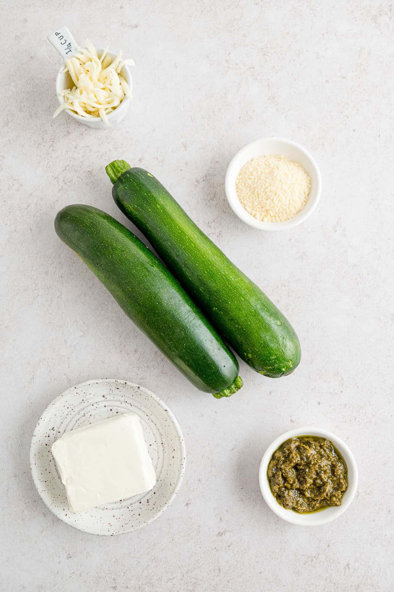 Ingredients needed for recipe, including two fresh zucchini.