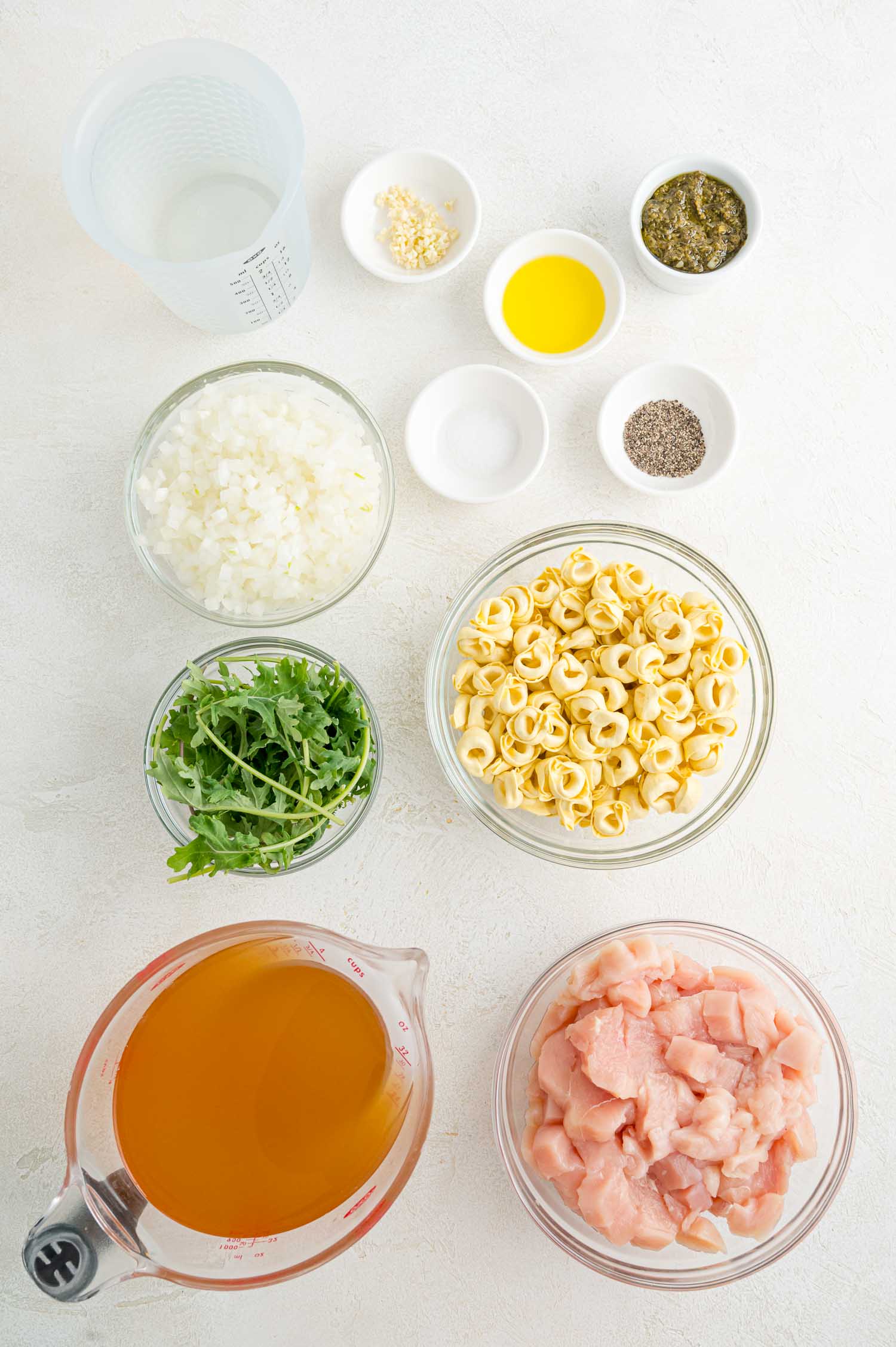Ingredients needed for soup, each in separate bowls.