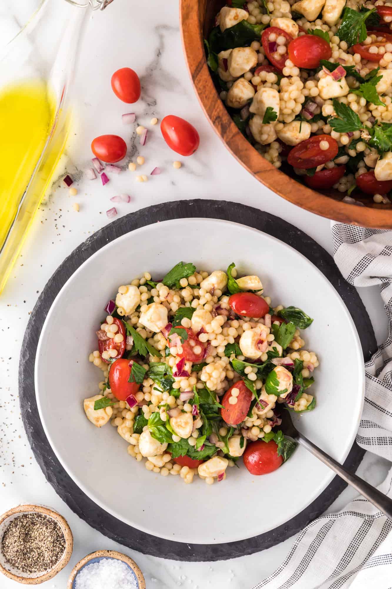 Couscous salad dished up into a smaller bowl.