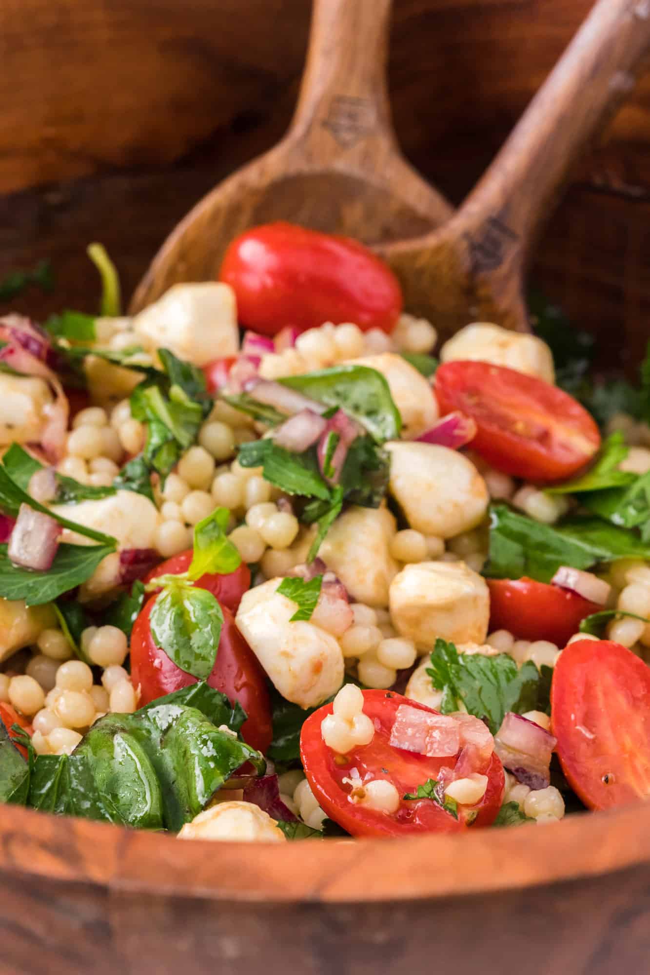 Salad being stirred together.