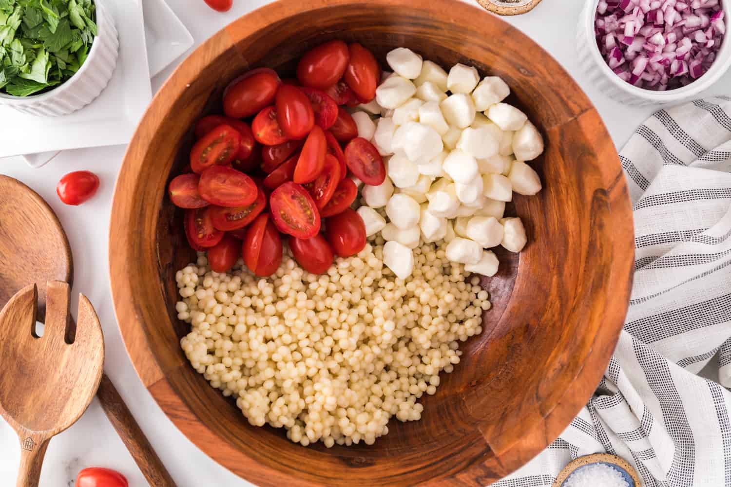 Tomatoes added to bowl.