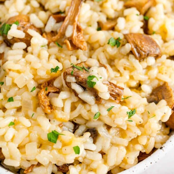 Creamy mushrooms risotto garnished with fresh parsley.