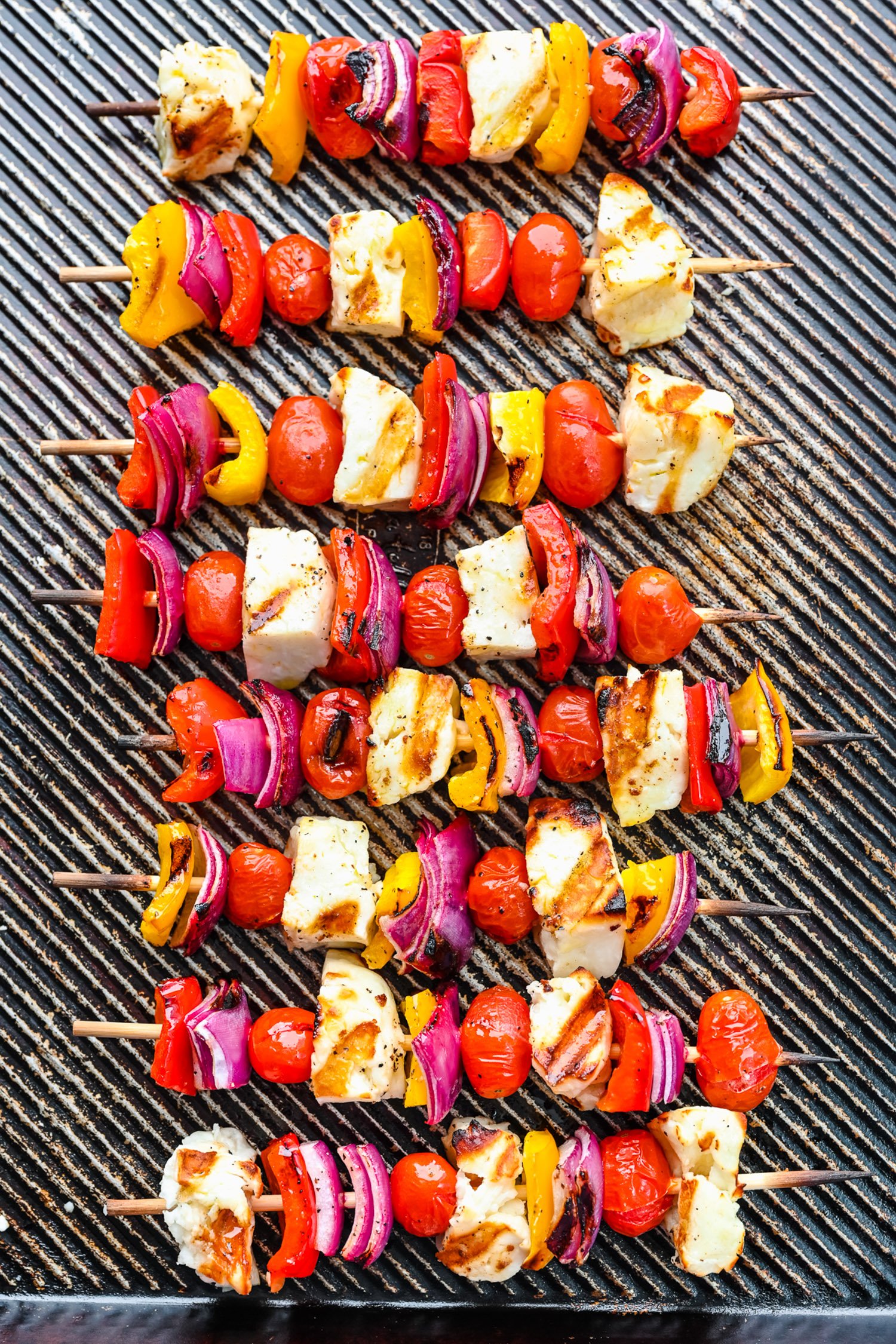 Grilled halloumi kebabs on a sheet pan.