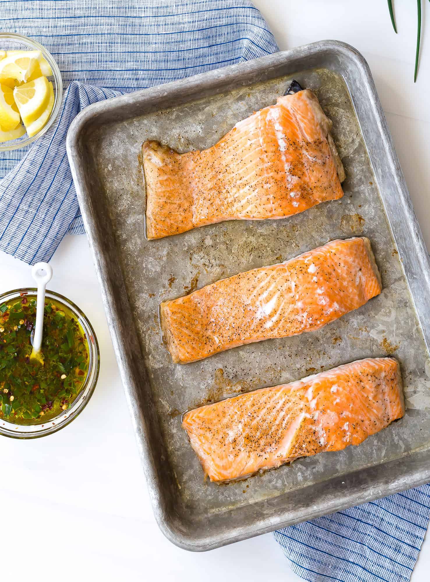 Baked salmon seasoned with salt and pepper.