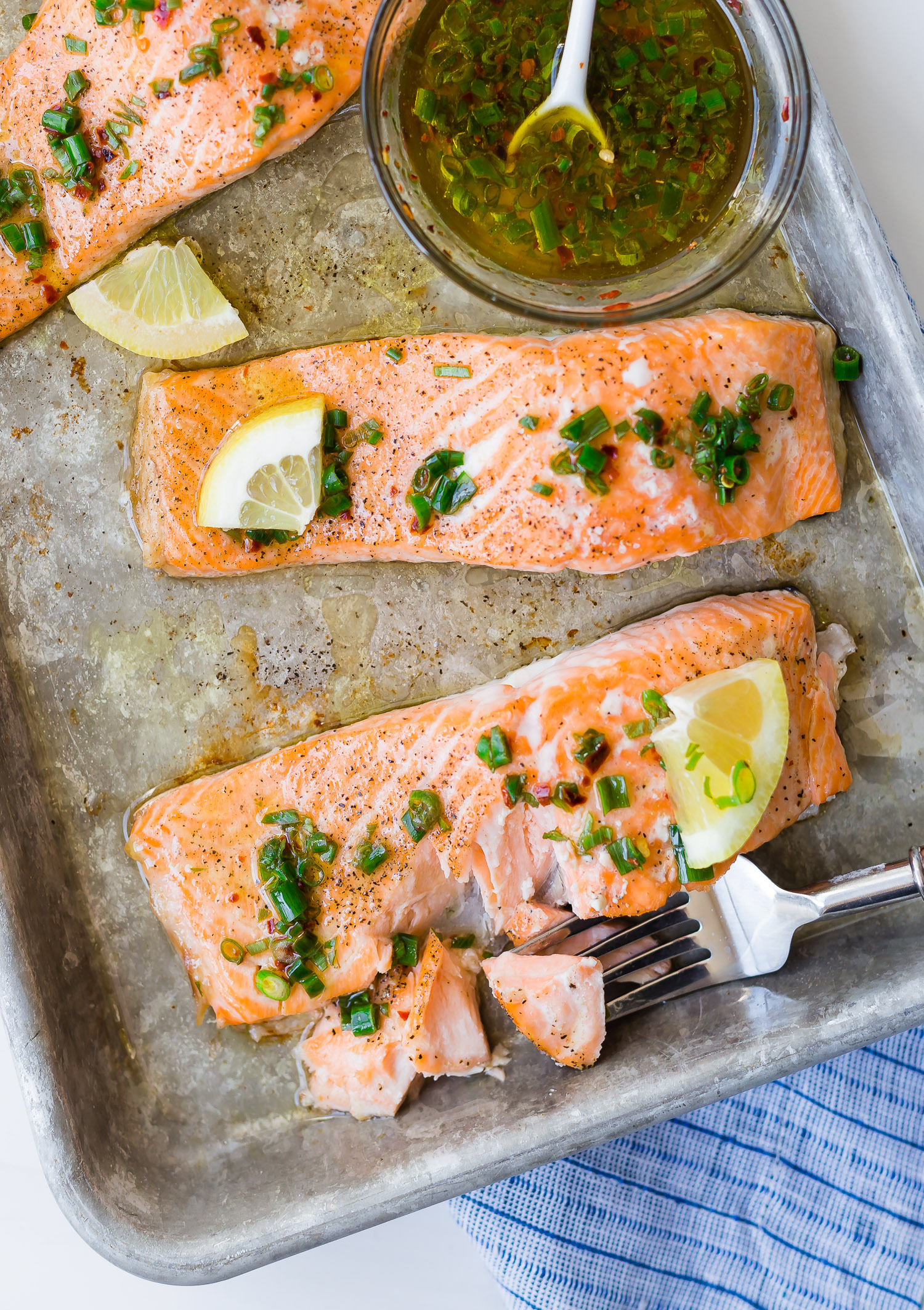 Salmon being flaked with fork.