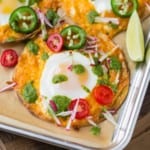 Sheet pan breakfast tostada with tomatoes, jalapeno, radish.