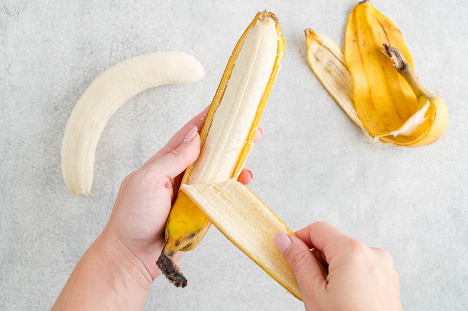 Banana being peeled.