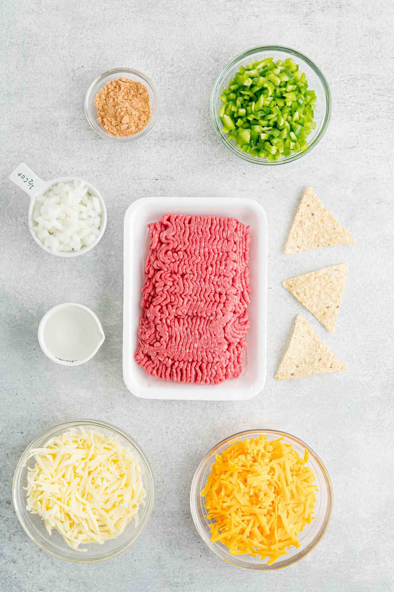 The ingredients for ground beef nachos.