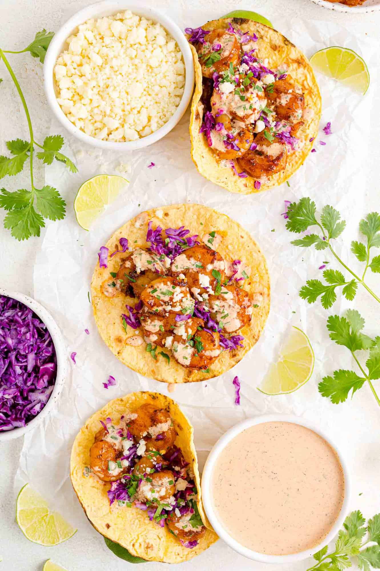 Tacos, laid out flat to show filling and toppings.