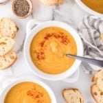 Vegan butternut squash soup in a white crock style bowl.