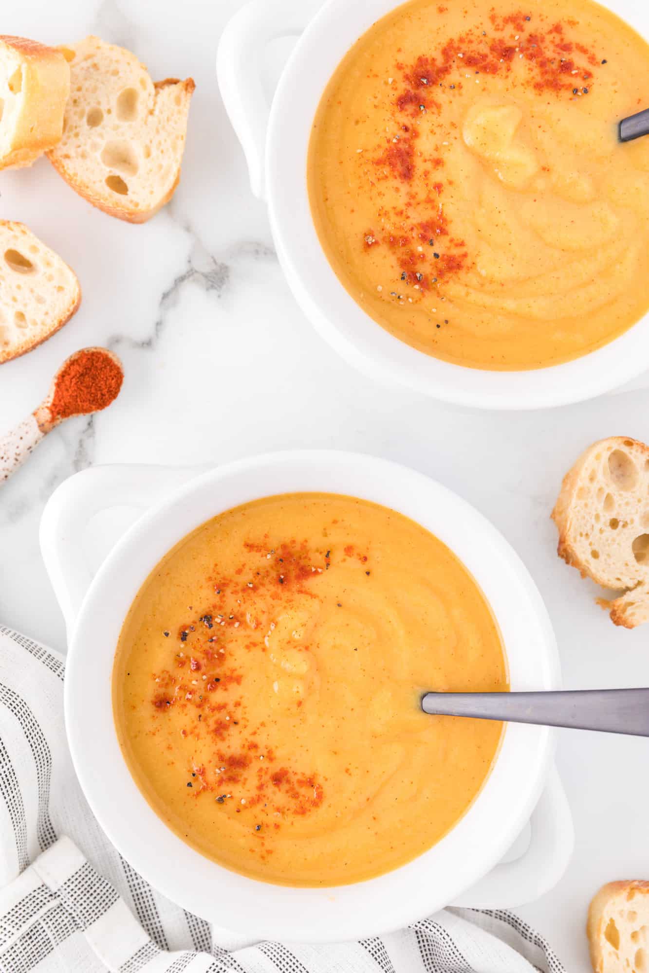 Vegan butternut squash soup garnished with smoked paprika.