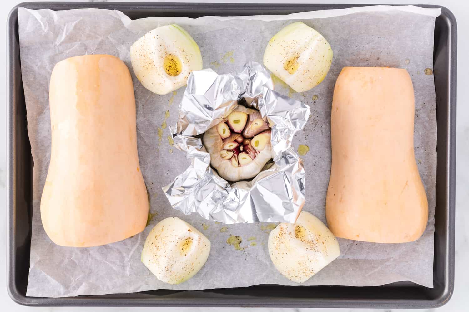 Ingredients on a sheet pan before baking.