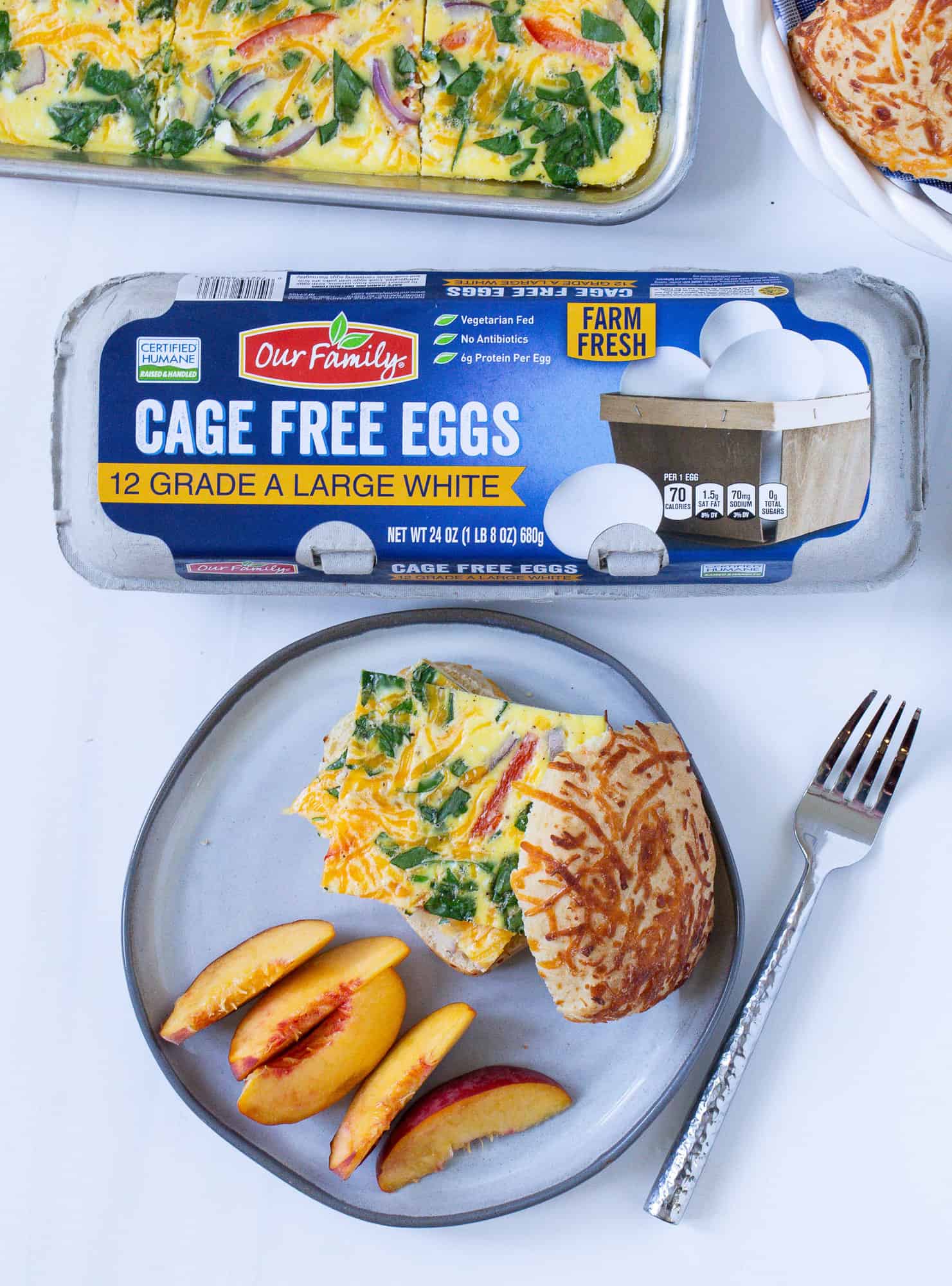 Sheet pan eggs with a carton of eggs in photo as well.