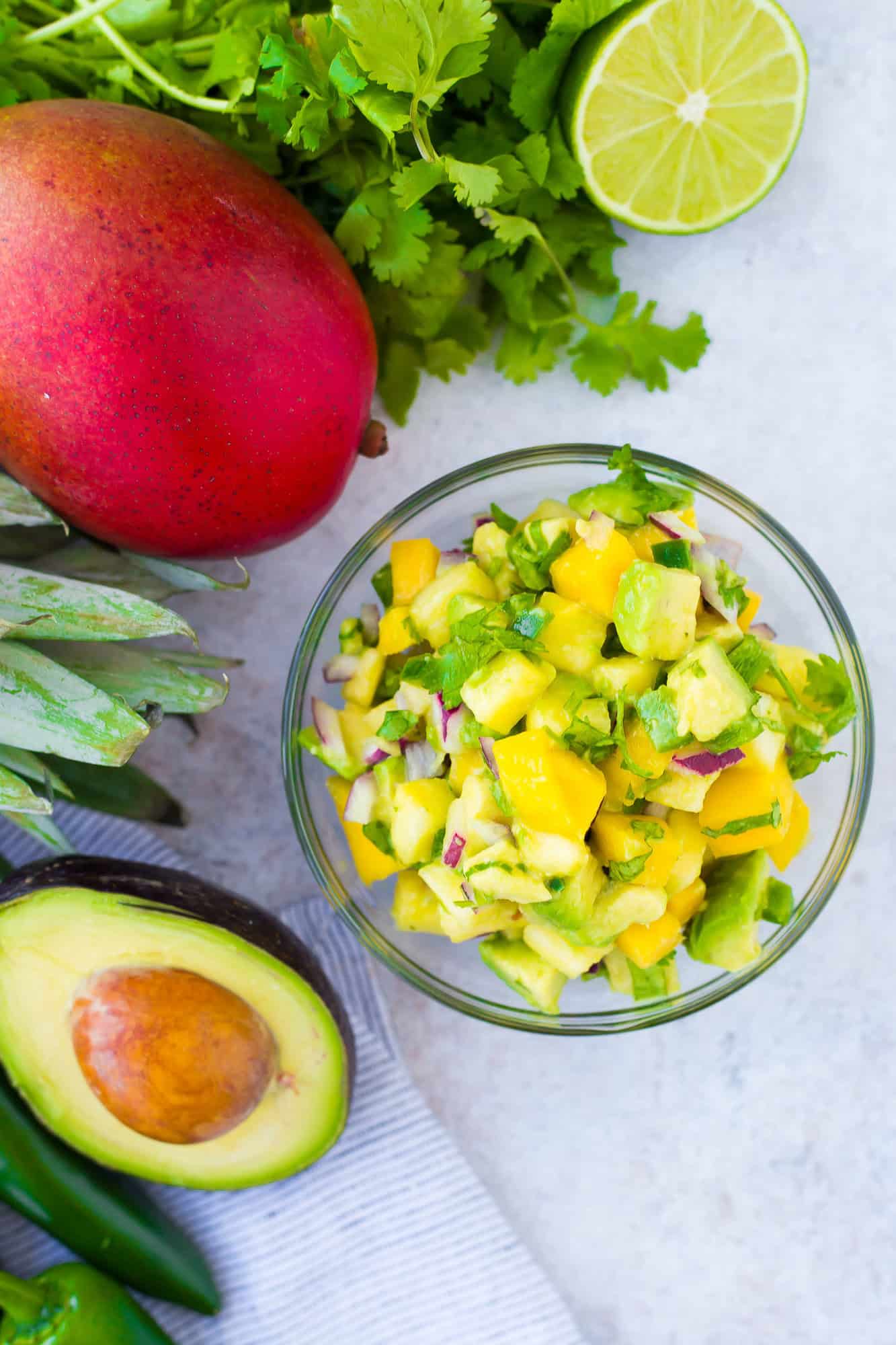 Mango avocado salsa in a small glass bowl.