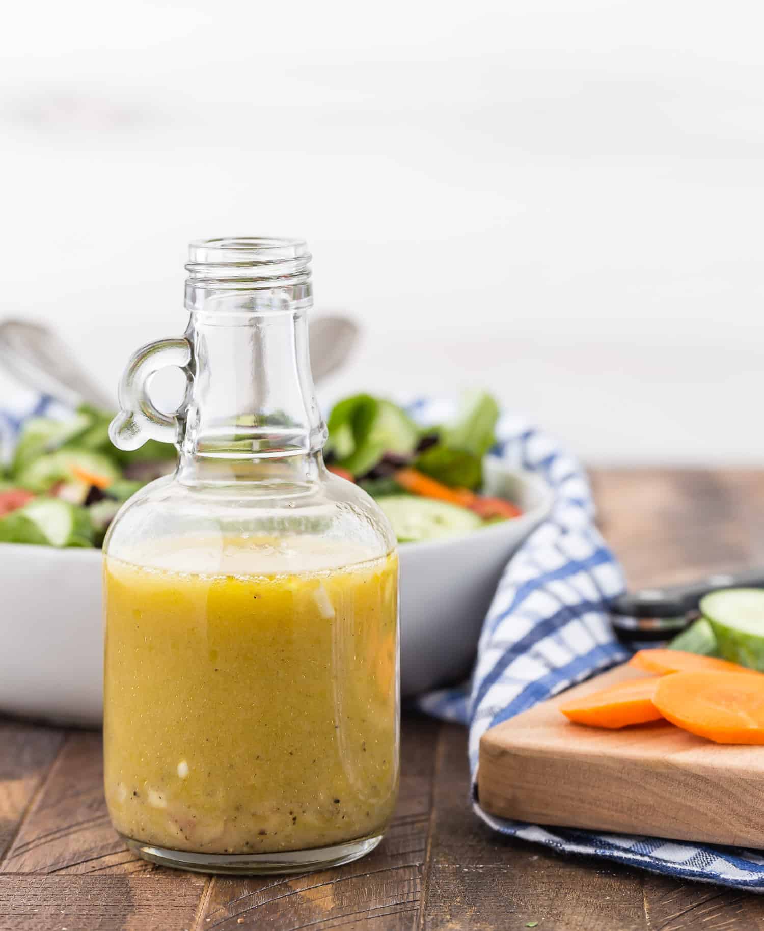 Vinaigrette with a salad in the background.