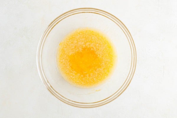 Wet ingredients in a glass mixing bowl.