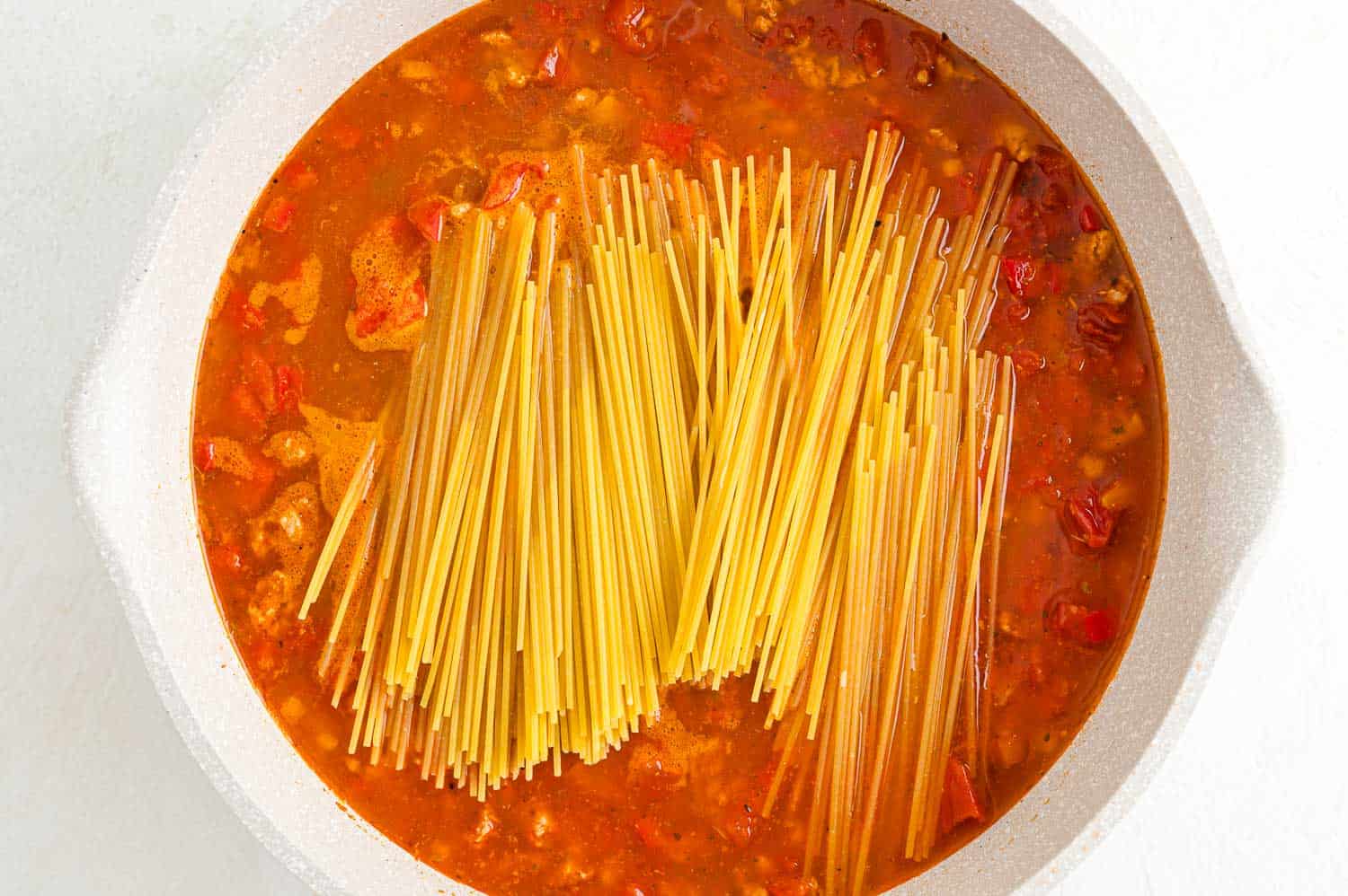 Pasta added to pan.