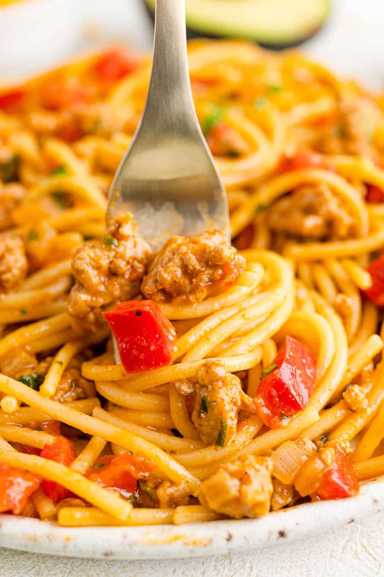 Mexican spaghetti, shown twirled around a fork.