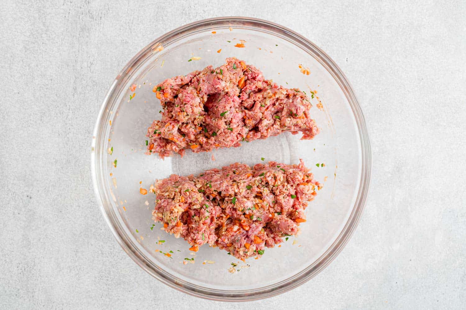 Meatloaf mixture formed into two portions.