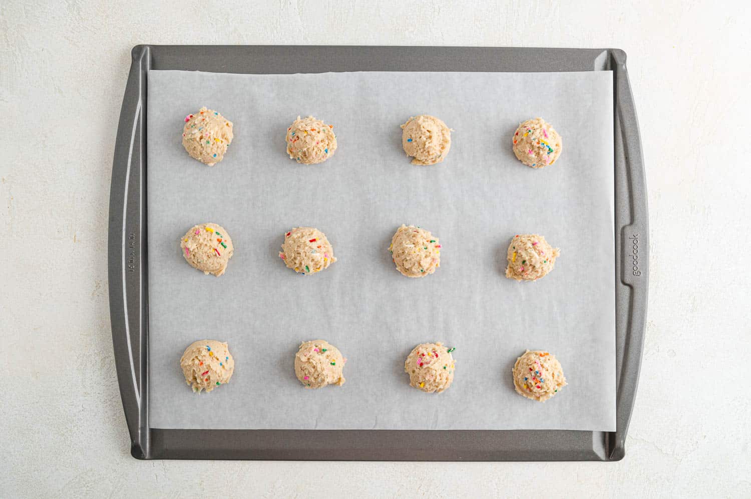 Unbaked cookie dough on cookie sheet.