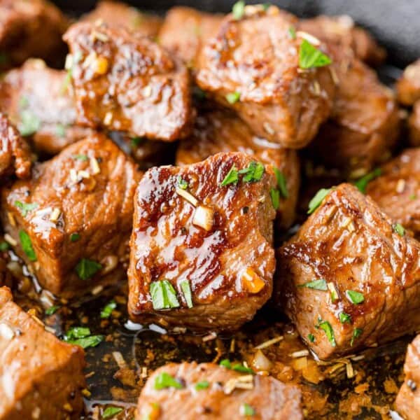 Garlic butter steak bites, sprinkled with parsley.