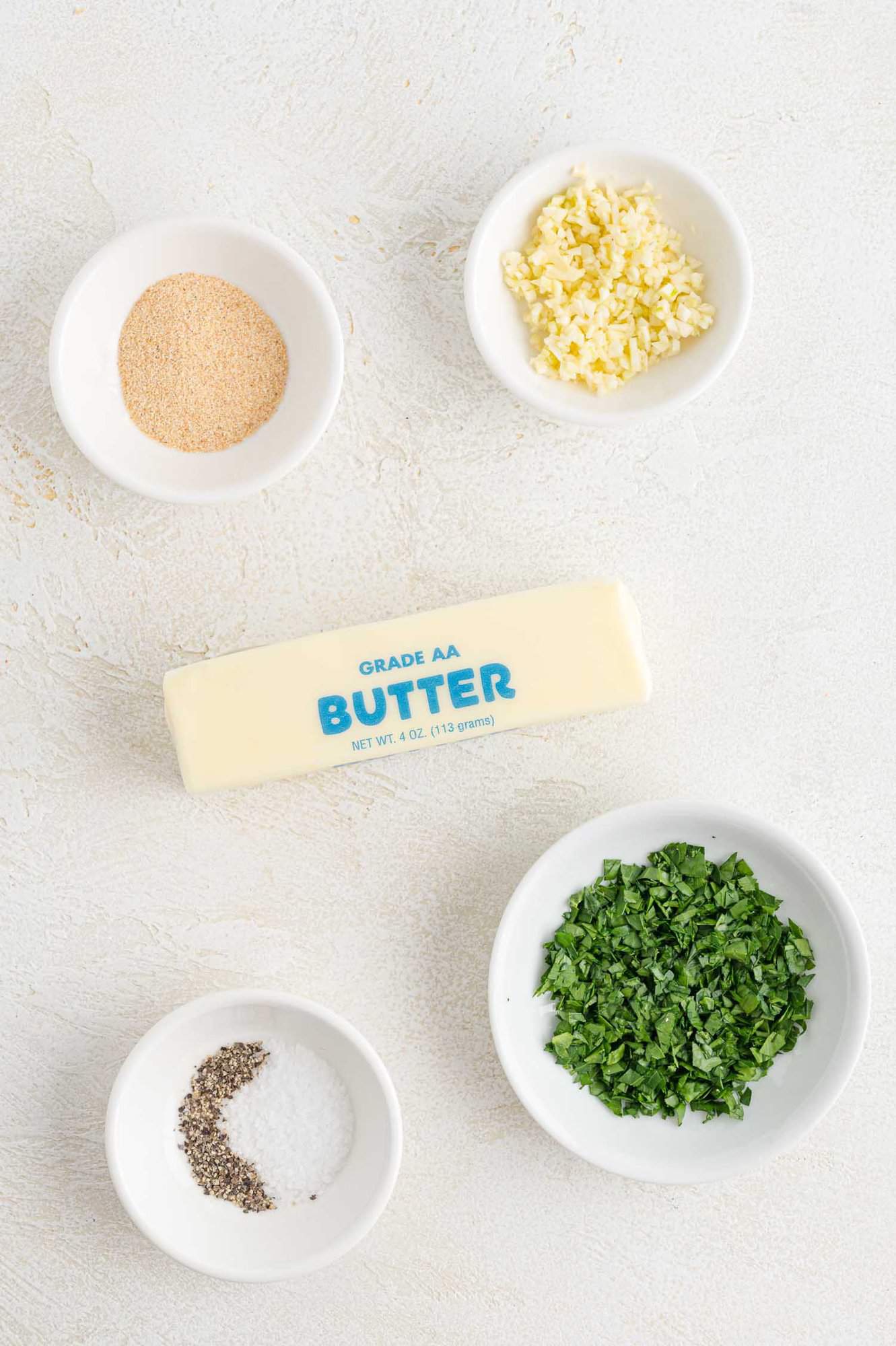 Ingredients needed for recipe, including butter, garlic, parsley.