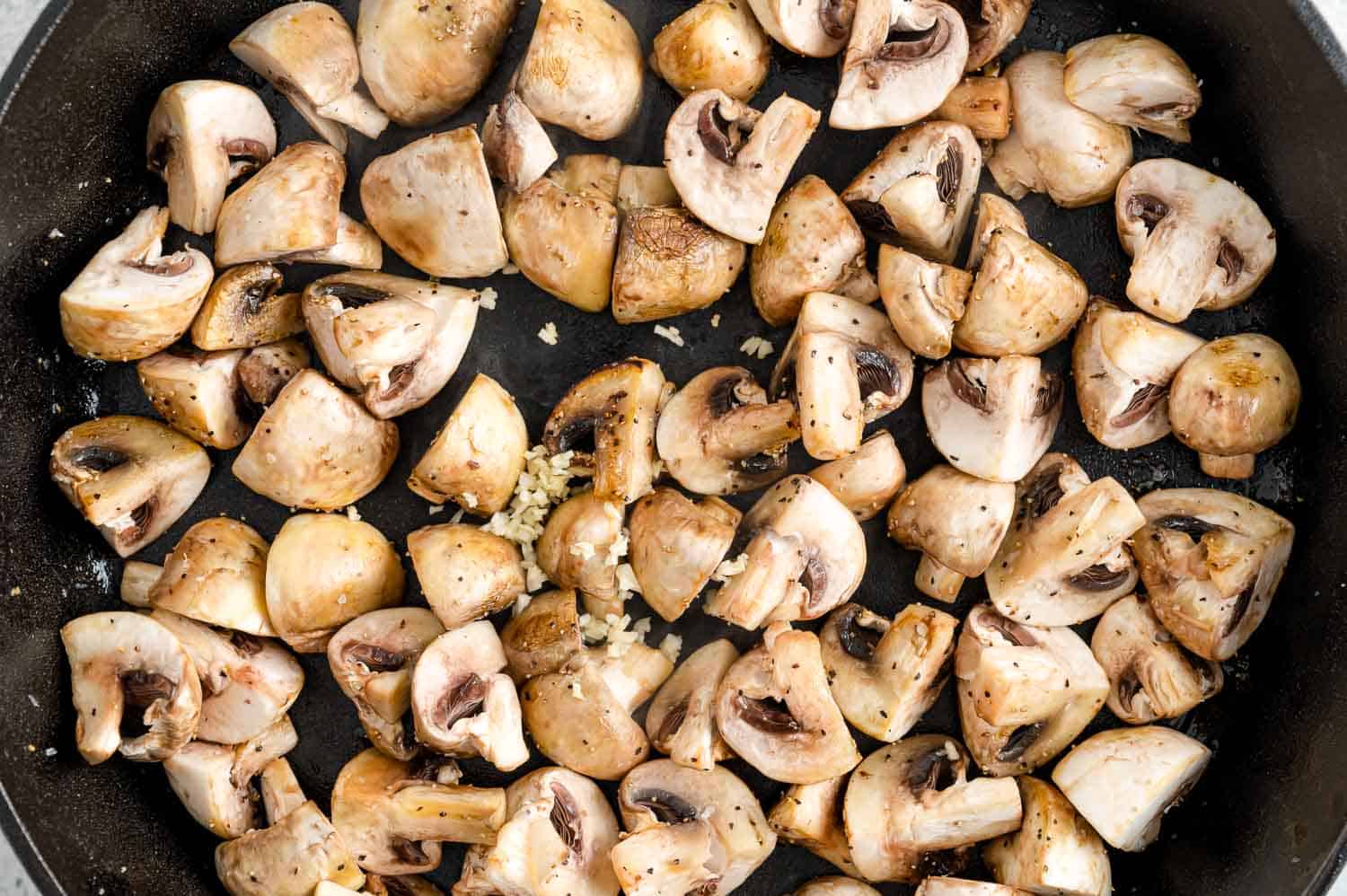 Garlic added to mushrooms.
