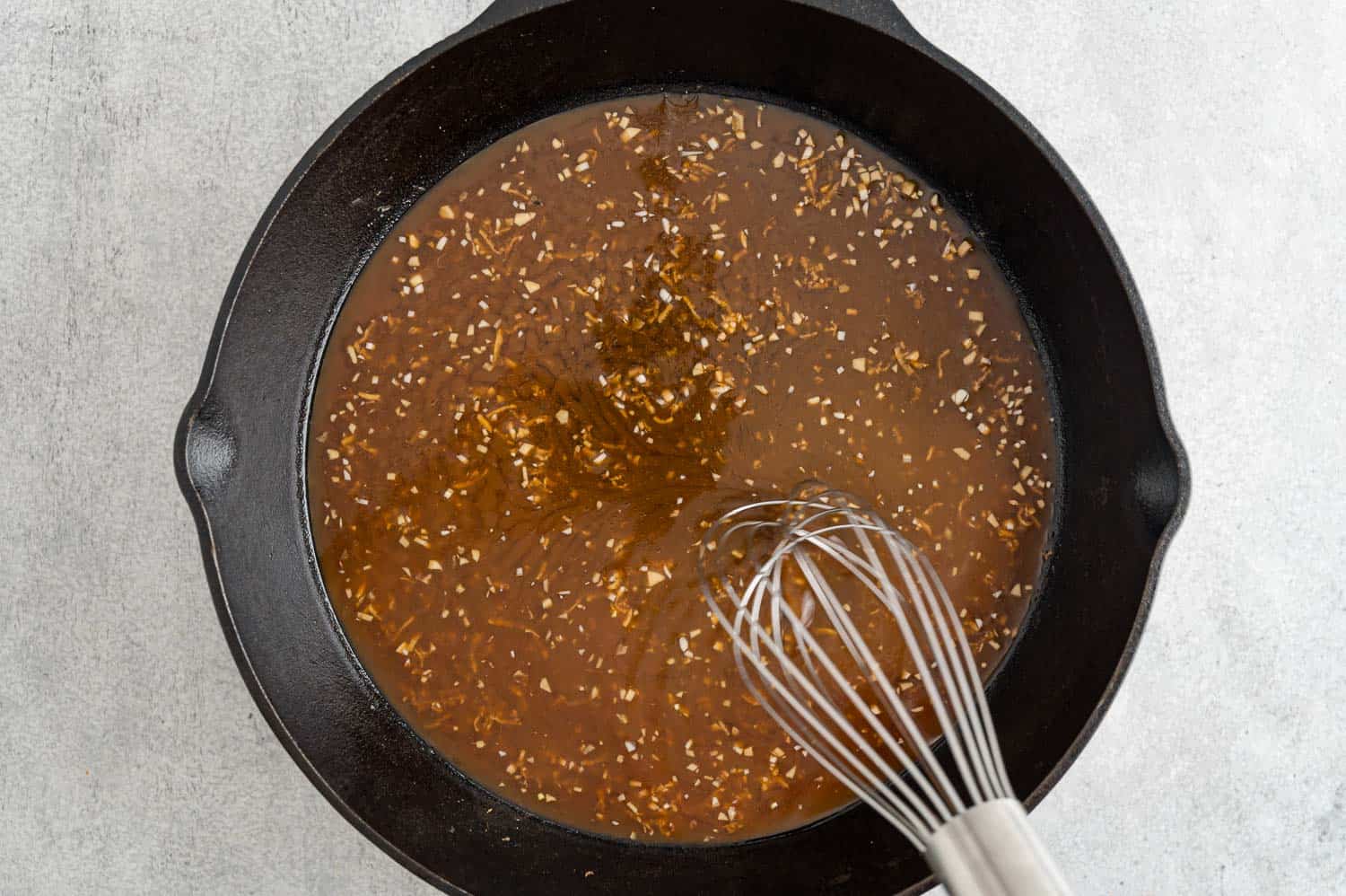 Teriyaki sauce being made in frying pan.