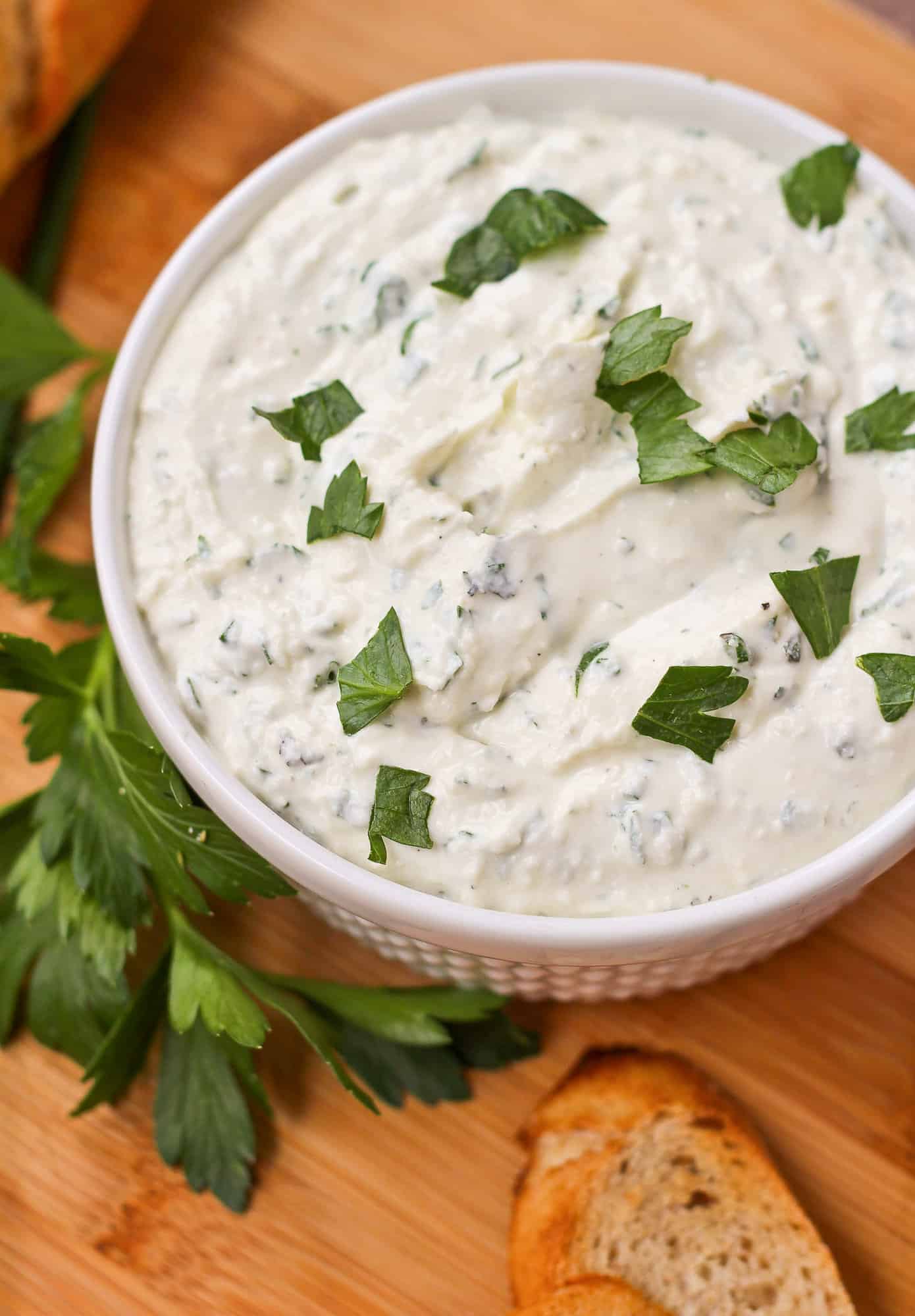 Herbed feta dip sprinkled with parsley.