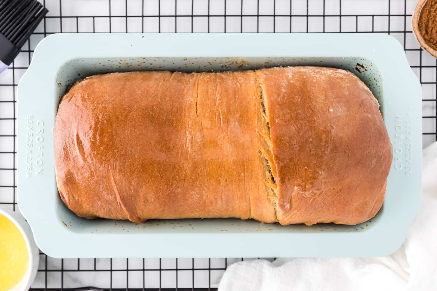 Baked bread, in loaf pan.