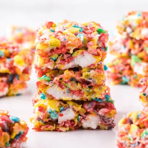 Stack of three fruity pebbles treats.