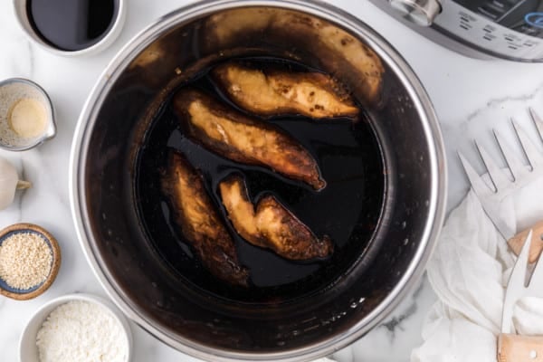 Cooked chicken in teriyaki sauce inside the instant pot.