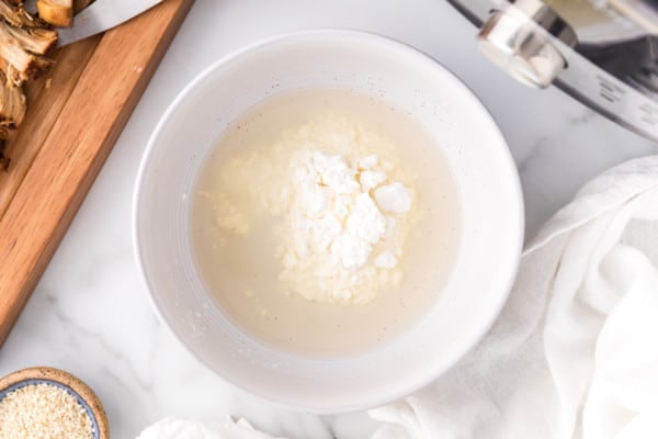 Cornstarch combined with water in a bowl, to make a slurry.